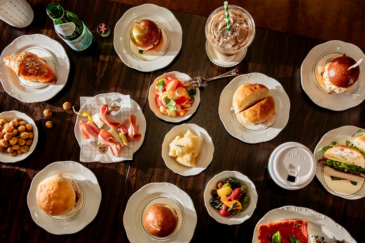 a bunch of food sitting on top of a wooden table